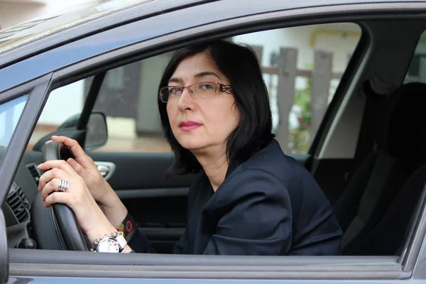 the sleepy woman driving a car