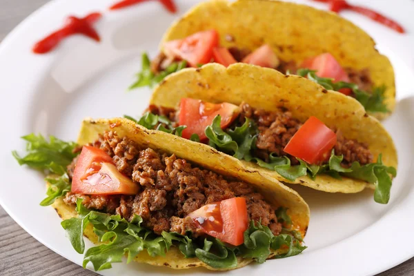 Drie taco schelpen op de plaat Stockfoto