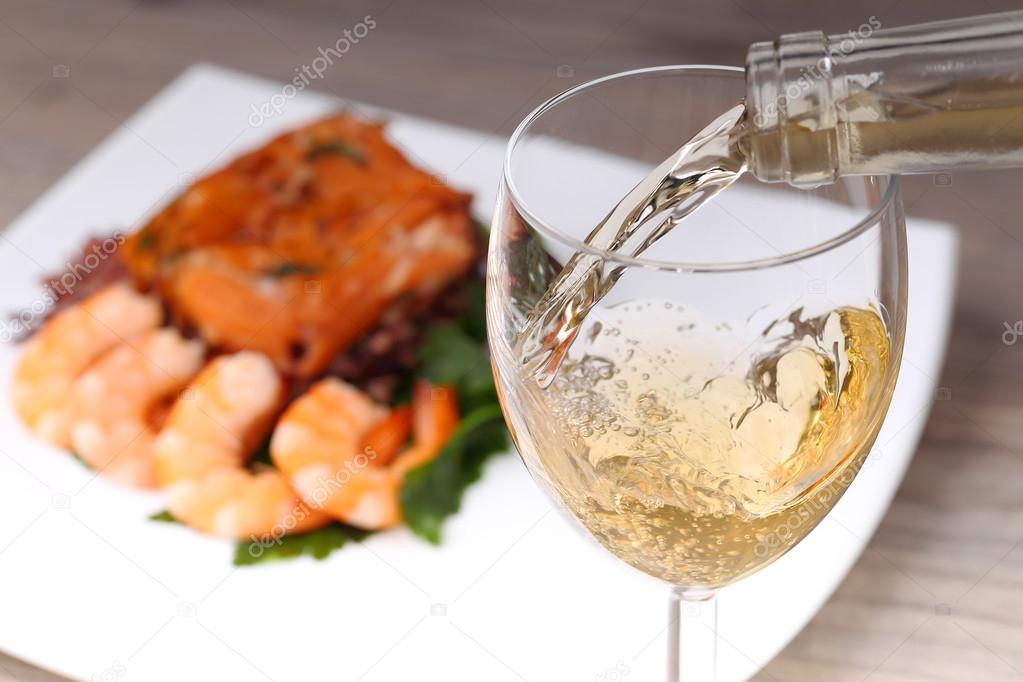 Pouring white wine and background