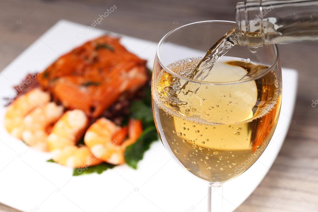 Pouring white wine and background