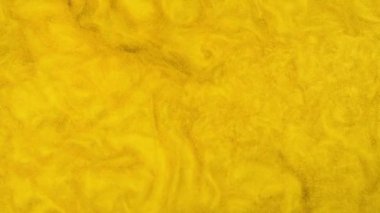 Altın tozu çalkantılı arka plan. Güneş yüzeyi. Çok güzel akıyor. Mükemmel kopyalama alanı.