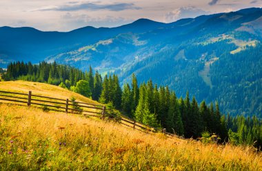 Landscape with fog and a haystack clipart