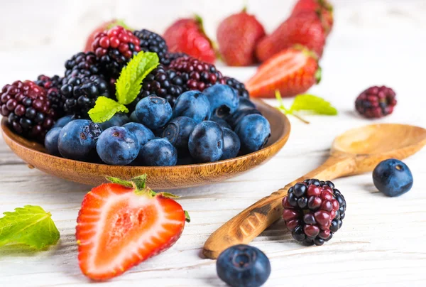 Bunch of wild berries and mint — Stock Photo, Image