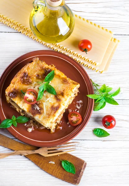 Italian lasagna and parmesan cheese — Stock Photo, Image