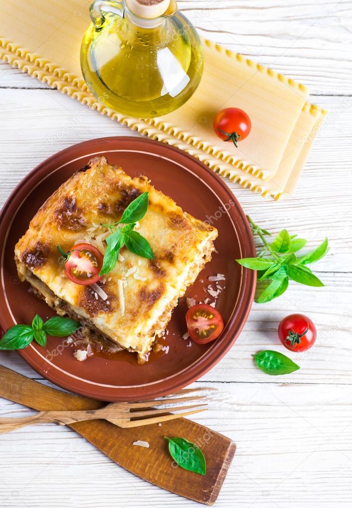 Italian lasagna and parmesan cheese
