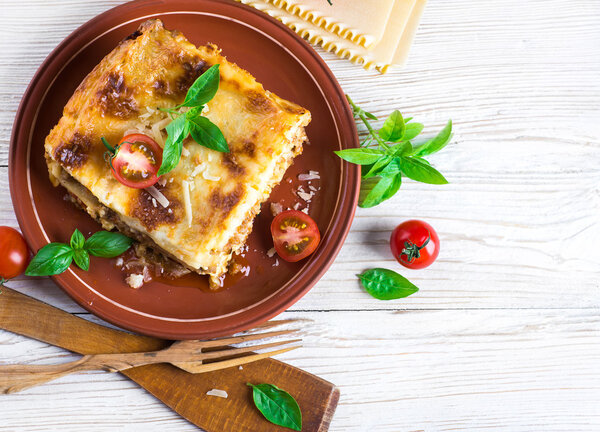 Italian lasagna and parmesan cheese