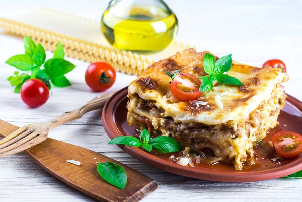 Italian lasagna and parmesan cheese — Stock Photo, Image