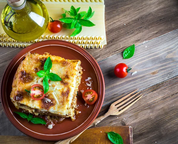 Italian lasagna and parmesan cheese — Stock Photo, Image