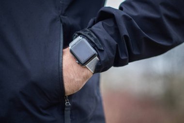 Man with a watch for a walk in nature.