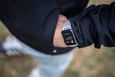 Man with a watch for a walk in nature.
