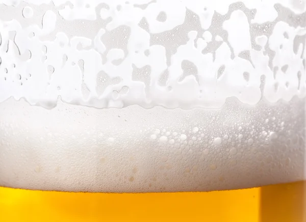 Beer bubbles in mug — Stock Photo, Image