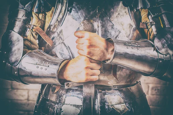 Knight wearing armor with sword — Stock Photo, Image