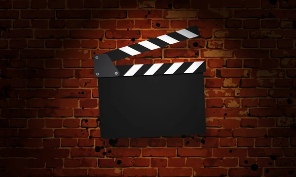 Movie clapperboard on a grunge — Stock Photo, Image