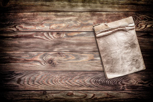 Old notebook on old wooden background — Stock Photo, Image