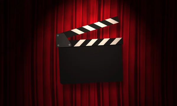 Movie clapperboard on a red — Stock Photo, Image