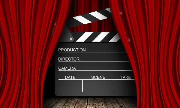 Movie clapperboard on a red — Stock Photo, Image