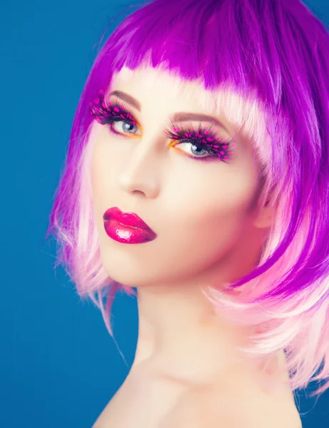 Beautiful woman wearing colorful wig — Stock Photo, Image