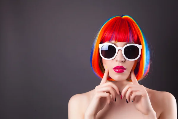 Beautiful woman wearing colorful wig — Stock Photo, Image