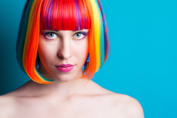 beautiful woman wearing colorful wig