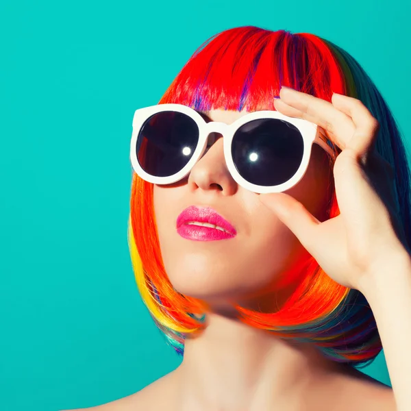 Beautiful woman wearing colorful wig — Stock Photo, Image