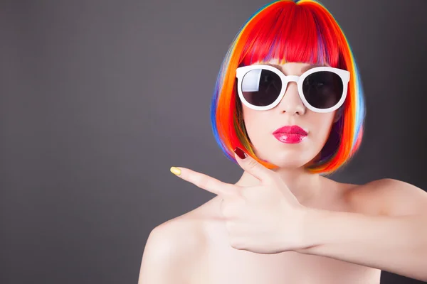 Beautiful woman wearing colorful wig — Stock Photo, Image