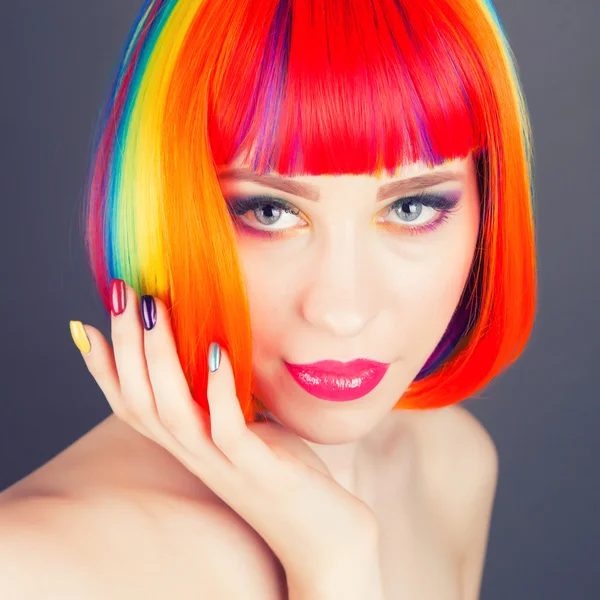 Beautiful woman wearing colorful wig — Stock Photo, Image