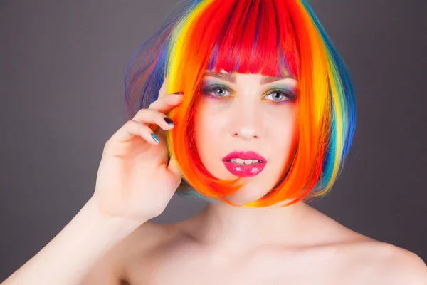 Beautiful woman wearing colorful wig — Stock Photo, Image