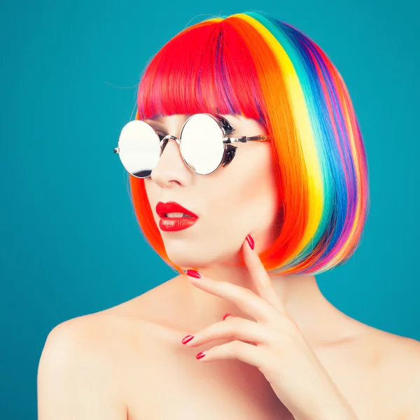 Beautiful woman wearing colorful wig — Stock Photo, Image