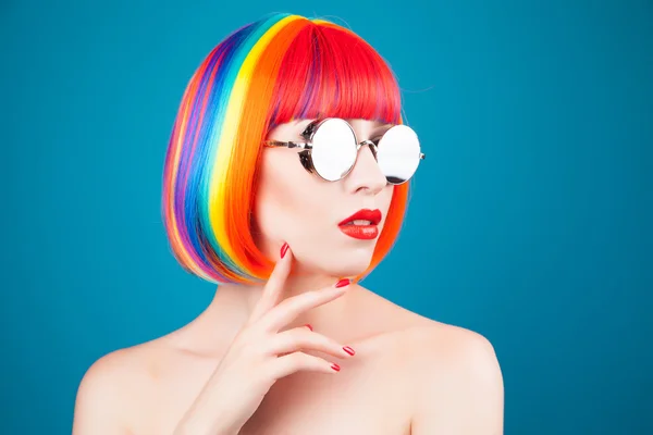 Beautiful woman wearing colorful wig — Stock Photo, Image