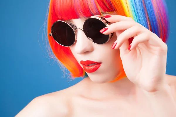 Beautiful woman wearing colorful wig — Stock Photo, Image