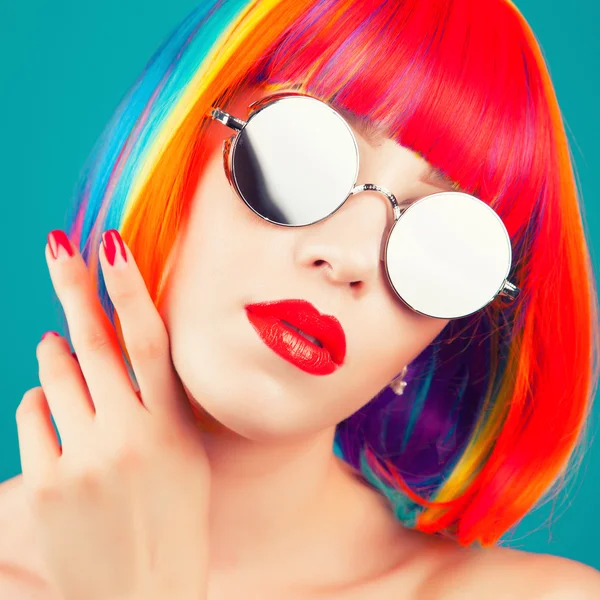 Beautiful woman wearing colorful wig — Stock Photo, Image