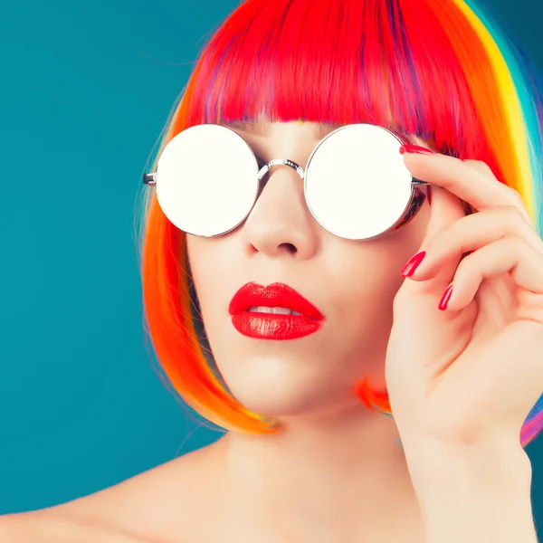 Beautiful woman wearing colorful wig — Stock Photo, Image