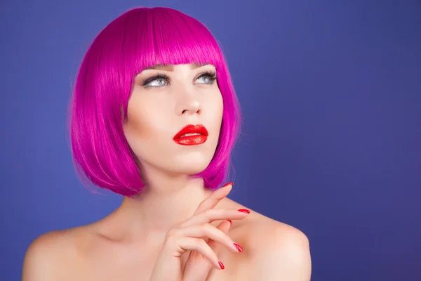 Beautiful woman wearing colorful wig — Stock Photo, Image