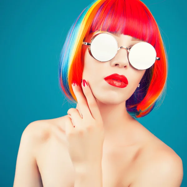 Beautiful woman wearing colorful wig — Stock Photo, Image