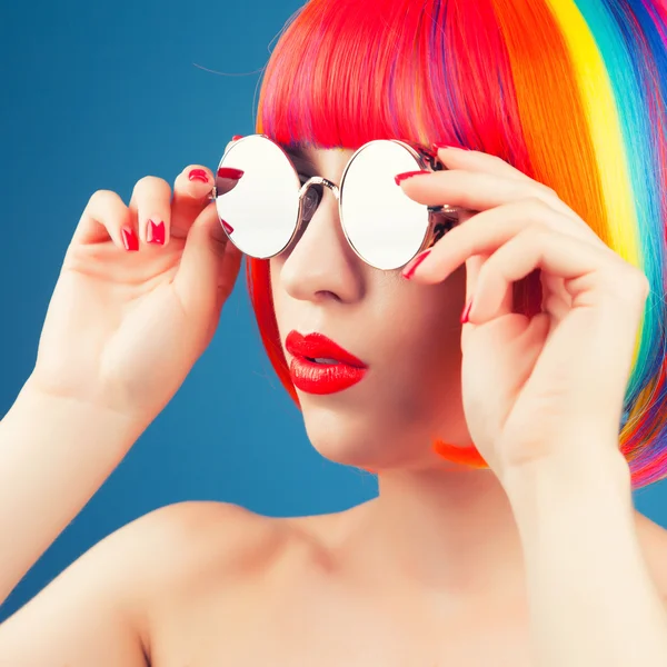 Beautiful woman wearing colorful wig — Stock Photo, Image