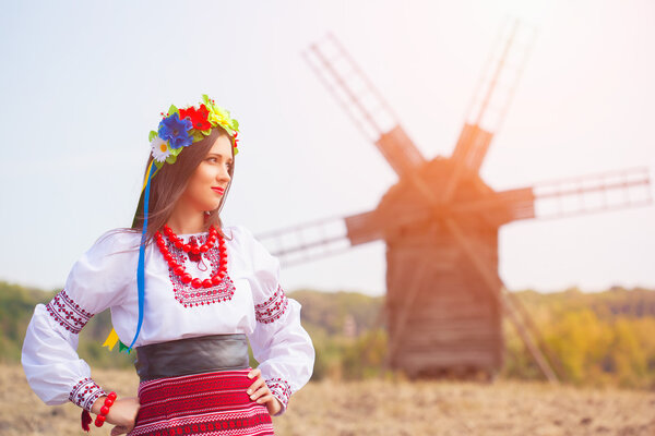 Woman wearing national ukrainian clothes outdoors