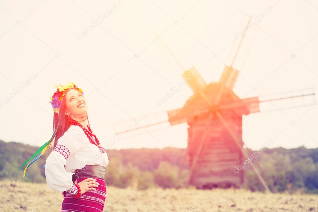 Woman wearing national ukrainian clothes outdoors