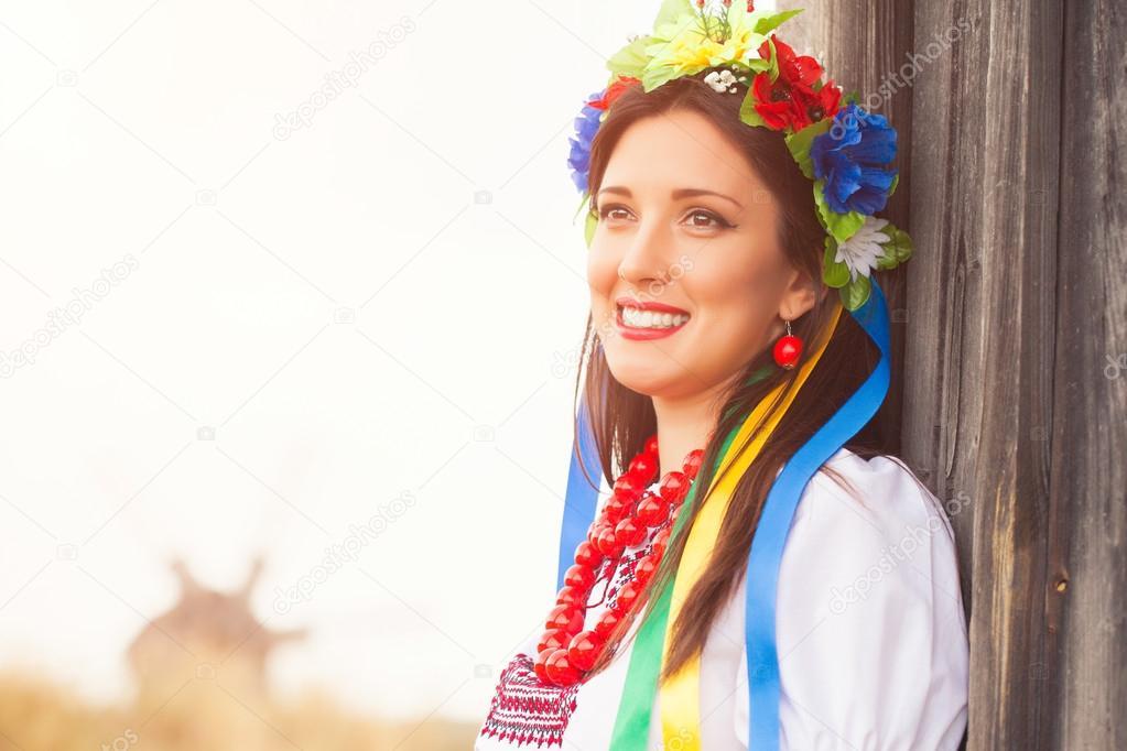 Woman wearing national ukrainian clothes outdoors