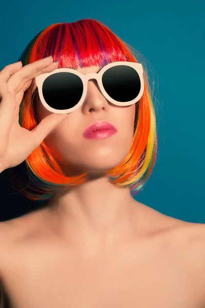 Beautiful woman in colorful wig — Stock Photo, Image