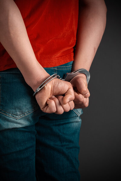 Male hands in handcuffs