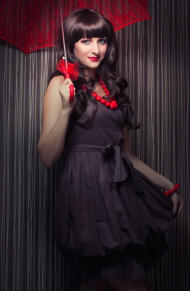 Woman posing with red lace umbrella — Stock Photo, Image