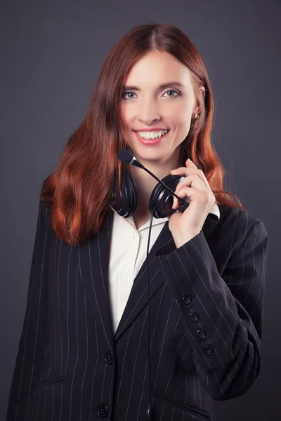 Business woman with headphones — Stock Photo, Image