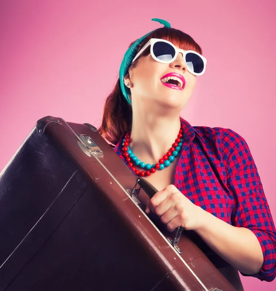 Pin-up girl posing with vintage suitcase — Stock Photo, Image