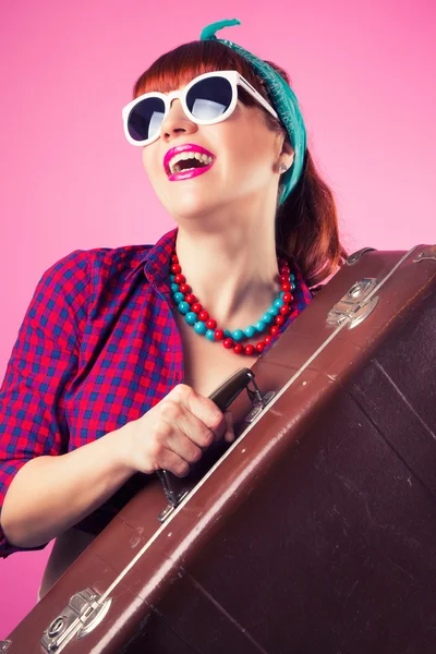 Pin-up girl posing with vintage suitcase — Stock Photo, Image