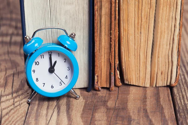 Vintage books and an alarm clock — Stock Photo, Image