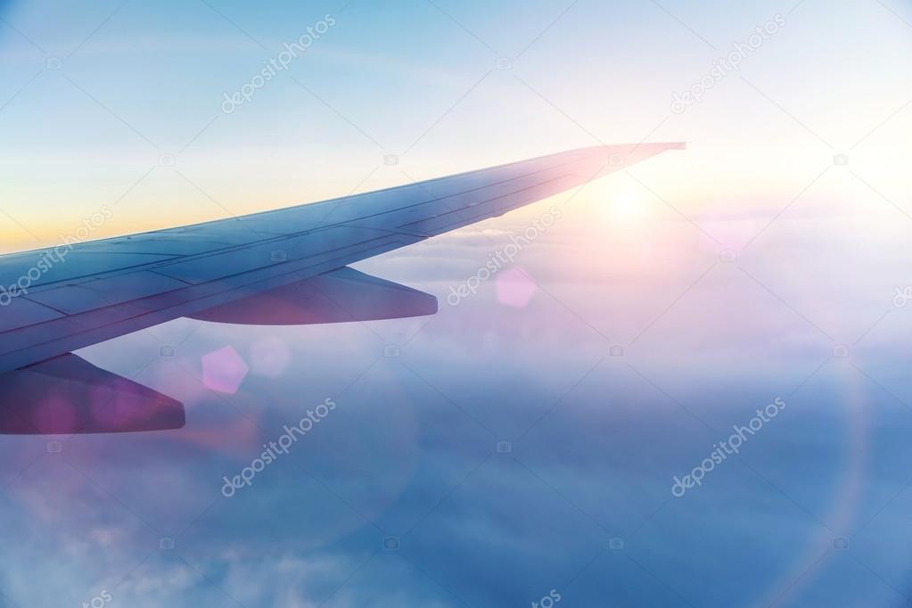 Wing of the plane on sky background