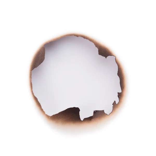 Burned hole in paper — Stock Photo, Image