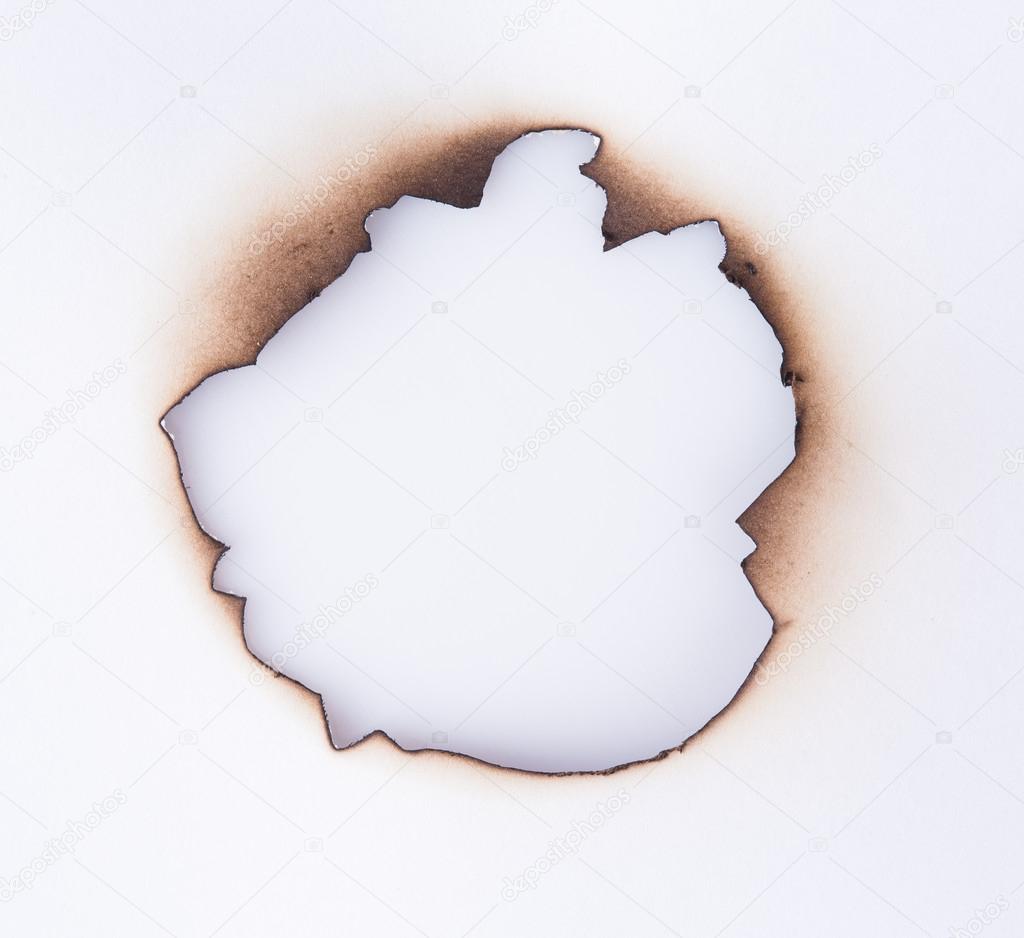 Burned hole in paper