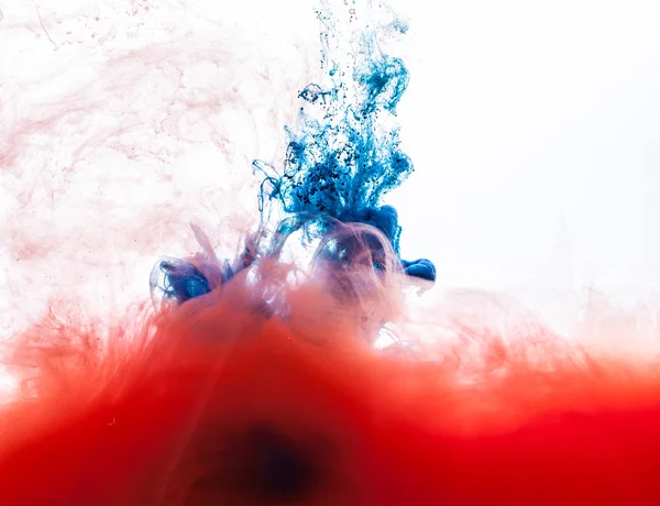 Blue and red inks in water — Stock Photo, Image