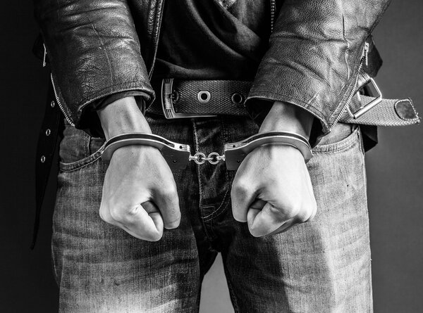 Male hands in handcuffs